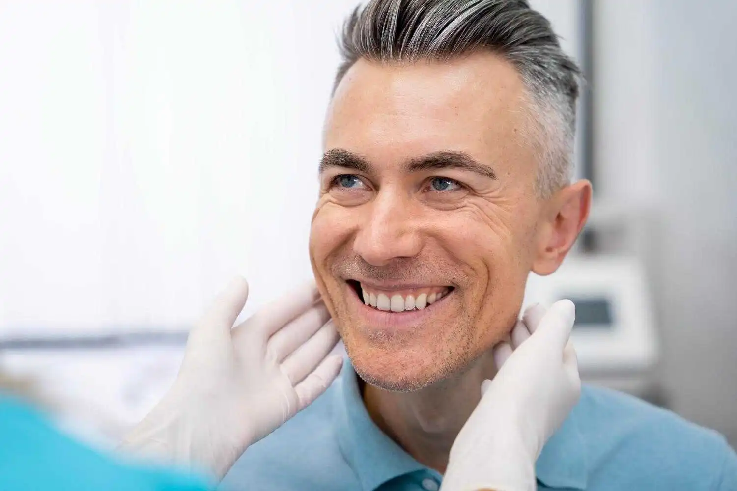 man smiling in dental clinic