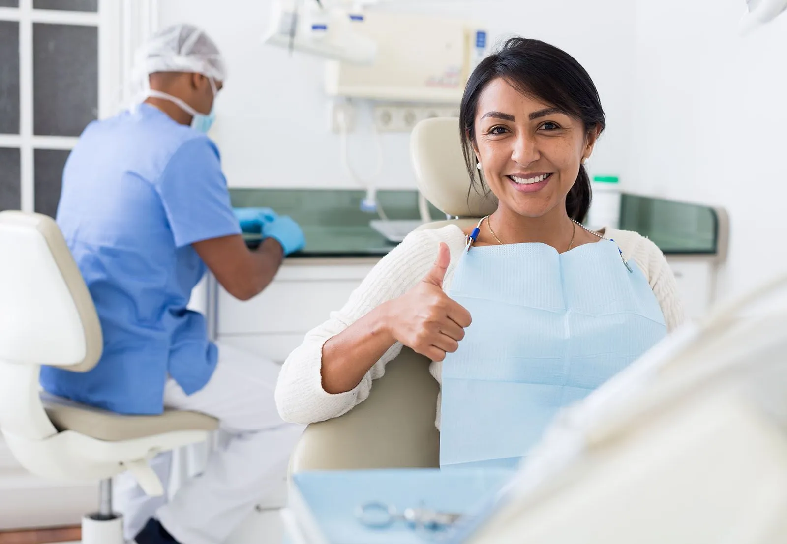 Satisfied woman after tooth removal treatment