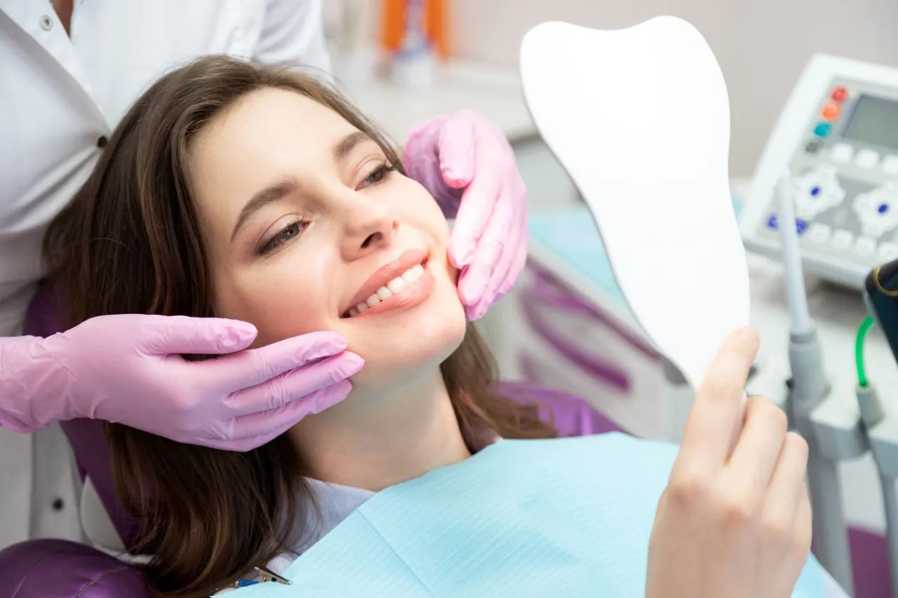 Happy patient after cosmetic dental treatment at Rosemary Heights Dental in Surrey, BC