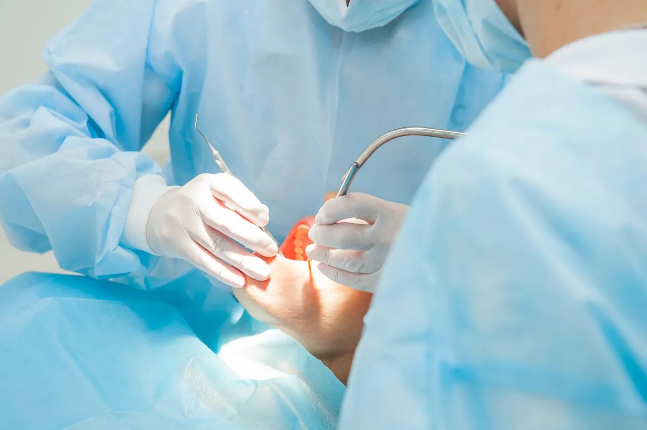 Dentist surgeon with assistant in Rosemary Heights Dental clinic